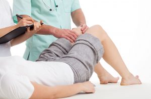 doctors diagnosing a girl leg ponds disease