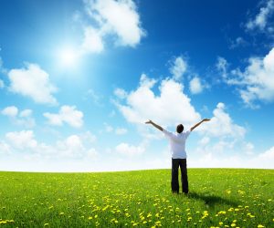 field of grass and happy young man