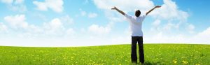 field of grass and happy young man