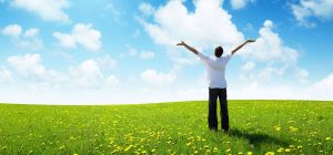 field of grass and happy young man